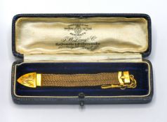 A 9ct gold woven chain, cased (not correct box).