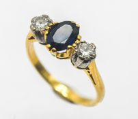 A diamond and sapphire three stone ring, size G, approx 2.6g (not hallmarked).