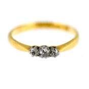 A small three stone diamond ring, set in 18ct yellow gold, size M/N, approx 2.1g