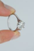 A fine large diamond single stone ring, set with a transitional brilliant cut diamond,
