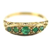 A five stone emerald set ring, set in 9ct yellow gold, size L/M, approx 2.1g.