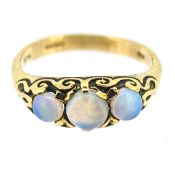 A three stone opal ring, set in 9ct yellow gold, size M, approx 2.3g.
