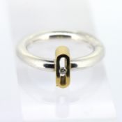 A Danish open work modern ring, set in silver and gilt with a small diamond, size O, approx 8.1g.
