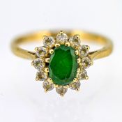 A emerald and diamond cluster ring, set in 9ct yellow gold, size J, approx 2.2g.