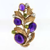 Bernard Instone, a 9ct gold amethyst, diamond and peridot set brooch of leaf design, approx 15.5g.