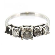 A five stone diamond set ring, set in 18ct white gold, size Q/R (one diamond is loose and not in
