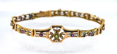 A amethyst, pearl and peridot set bracelet, set in 9ct gold, approx 7.8g. (some stones are