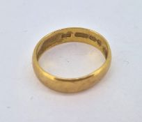 A 22ct yellow gold wedding band ring, approx 4.6g (misshaped)