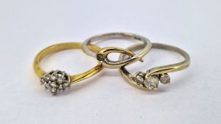 A three stone diamond ring set in 9ct white gold, size O, a 9ct gold 'Hot Diamonds' ring,