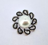 A diamond and pearl set pendant, set in 18ct white gold, marked 'Spires, DO.51, DO.11, DO.63',