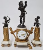 A three piece mantle clock, of gilt body with spelter cherub or cupid figures on a white stone
