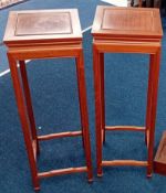 A pair of Chinese style hardwood stands, height 91cm. (2)