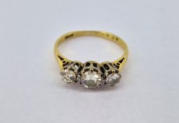 A diamond three stone set ring, set in 18ct yellow gold, size J, approx 2.2g.