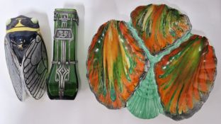 A green glass Art Nouveau style posy vase with white metal frame, together with a wall mounted