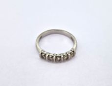 A five stone set diamond ring, set in platinum, size L/M, approx 3.8g.