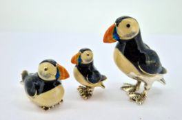 Three silver and enamel puffin birds, of various sizes, largest approx 4.5cm tall, total weight