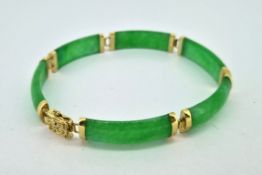 A 14k gold and jade set bracelet, total weight approx 12.3g.