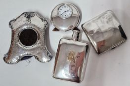 A silver desk clock, hallmarked Birmingham 1915, together with a silver flask and cigarette case,