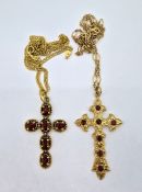 A 9ct gold cross set with orange stones on a 9ct gold chain, also another 9ct gold cross set with