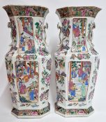 A pair of Canton ‘famille-rose’ baluster vases, mid-19th century, each of hexagonal section and well