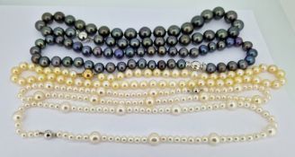 A 9ct gold clasp single row pearl necklace, a 14ct white gold clasp single row pearl necklace,