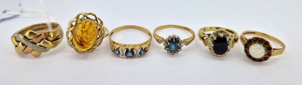 Six 9ct gold dress rings including a puzzle ring, total weight approx 16g.