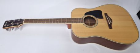 A Ibanez Artwood 6 string acoustic guitar with mother of pearl details, in soft carry case.