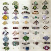 A mixed collection of forty five dress jewellery rings, some set in silver.