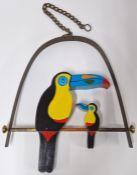 Brian Pollard (1946-) wood hanging sculpture of two toucan birds, painted and signed 'Pollard' to