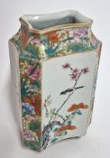 A ‘famille-rose’ facetted vase, of canted rectangular section on a short splayed foot, finely