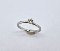 A small diamond solitaire ring, set in 18ct white gold, size J.