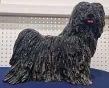 A ceramic sculpture of a Puli/Bergamasco dog, Italian, circa 1960s/70s, height approx 33cm, length