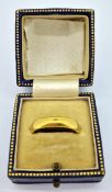 A 22ct gold wedding band ring, approx 6g.