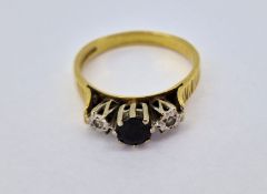 An 18ct gold diamond and sapphire dress ring, size R, approx 4.5g.