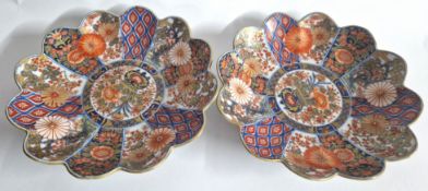 A pair of Japanese Imari dishes, Meiji period or later, each of lobed form with a central