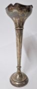 A silver spill vase, of trumpet form and filled base, hallmarked Birmingham 1924, height approx