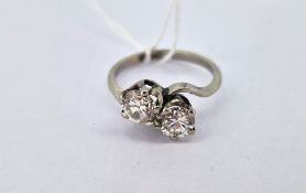 A diamond transitional brilliant cut two stone 'twist' ring set in platinum, approx 1ct total,
