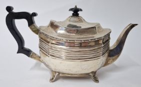 An Edward VII silver teapot, hallmarked Sheffield 1909, with ebonised wood handle and finial,