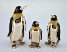 Three silver and enamel penguin birds, of various sizes, largest approx 6cm tall, total weight