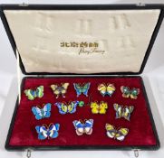 Peking Jewellery, a set of twelve enamel butterfly brooches, cased.