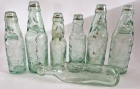 A collection of green glass Birmingham codd bottles, with another. (7)