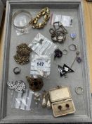 A mixed lot including silver buckle type bangle, silver jewellery, pendants etc.