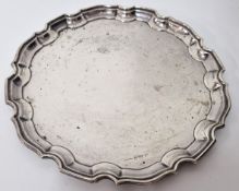 An early 20th century silver salver, hallmarked Birmingham 1927, diameter approx 25.5cm, weight