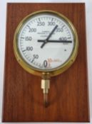 A novelty clock in the form of a ships combined pressure and vacuum meter, AP. 942-0766 PH. Bronze
