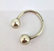 A silver key ring, marked Tiffany & Co 925.