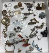 An assortment of items including brooches, coral earrings in form of hands, 9ct gold wishbone