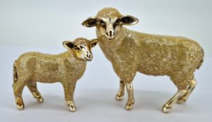 Two silver and enamel sheep, of various sizes, largest approx 7cm long, total weight approx 4.23oz.