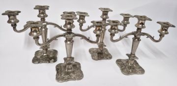 A set of four silver plated candlesticks, height approx 25cm.