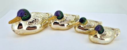Four silver and enamel mallard ducks, of various sizes, largest approx 8cm long, total weight