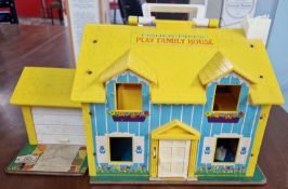 A Fisher Price Play Family House, with stairs, bed, play figures.